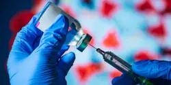 Gloved-individual-filling-needle-with-vaccine.jpg