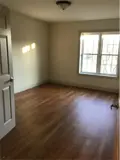 Spacious bedroom with large window