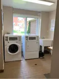 Washer, dryer and wash basin in laundry room