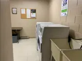 Washer, dryer and wash basins in laundry room