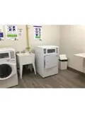 Washer, dryer and wash basin in laundry room