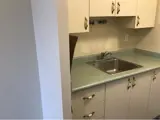 Cabinets and sink in kitchen area