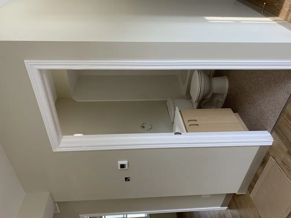 doorway into washroom showing toilet and vanity