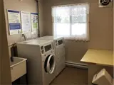 Wash basin, washer and dryer in laundry room