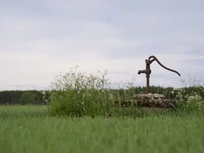 well-pump-in-grassy-field.jpg
