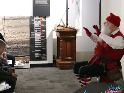 Families-listen-to-holiday-stories-from-Victorian-Santa-at-the-Oil-Museum-of-Canada-in-2024-web.jpg