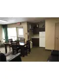 Kitchenette and table in Alvinston Apartment lounge