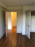 Bedroom with closet looking out to unit