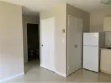 door to closet with hallway beside