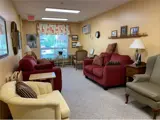 Armchairs and couches in cozy lounge area