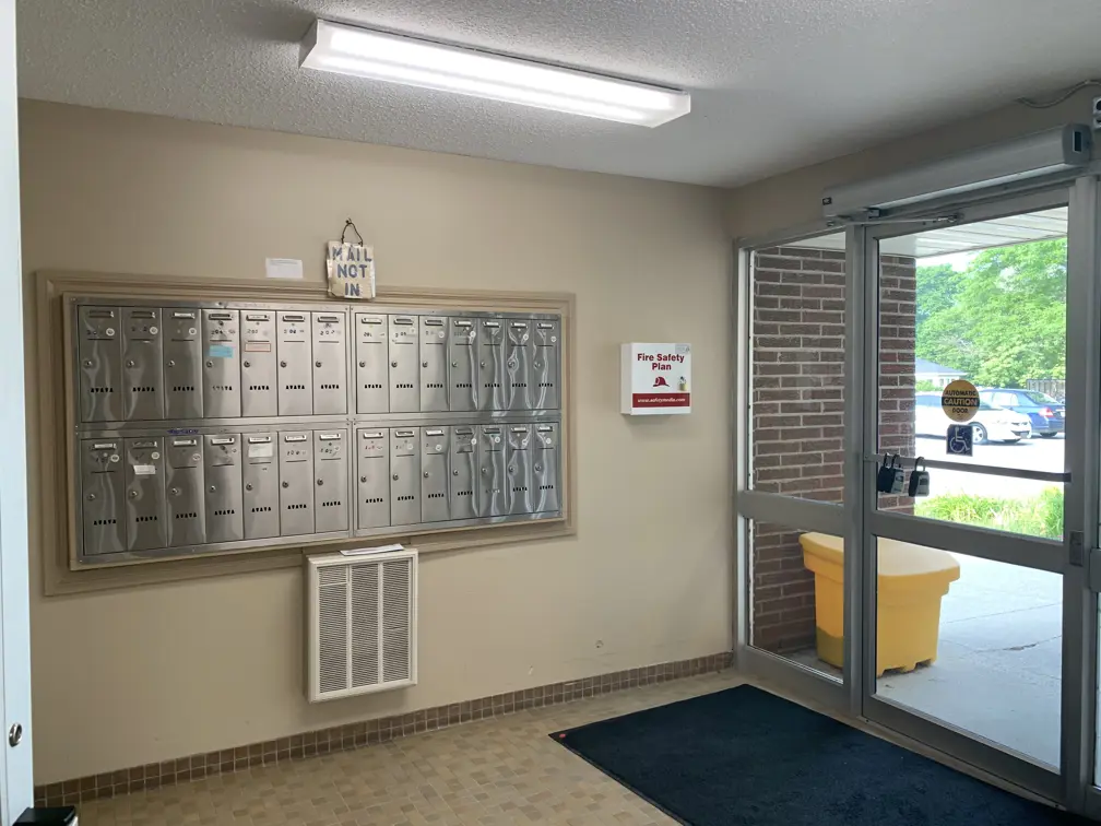 Mailboxes and front door in lobby
