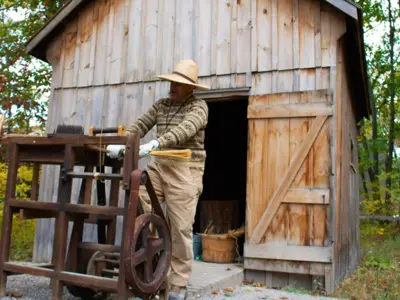 LHM-staff-performing-a-broom-making-demonstration-in-October-2022-web.png