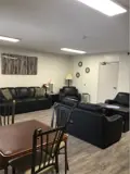 tables, chairs and armchairs in lounge area