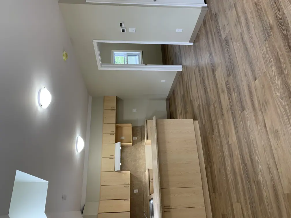 Kitchen with brown cabinetry and countertops