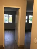 Hallway with doors leading to rooms