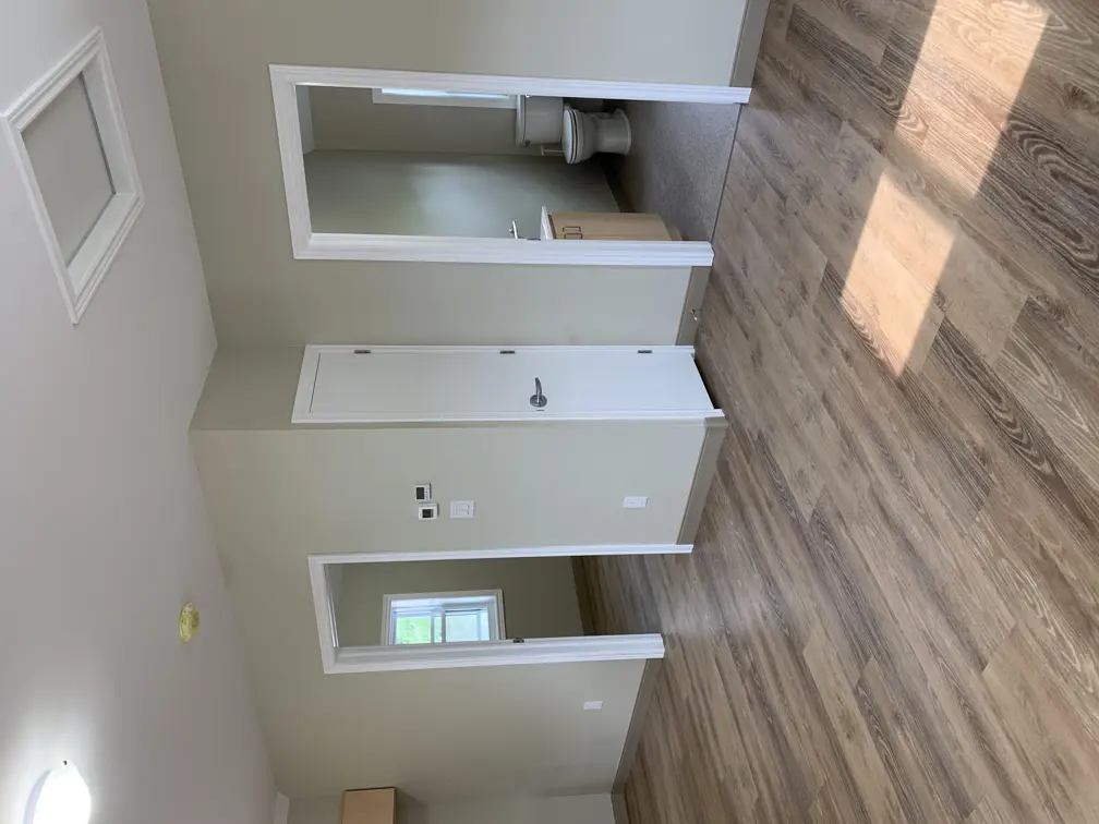 Living room showing entrances to bedroom and washroom