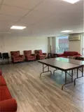 tables, chairs and armchairs in lounge area