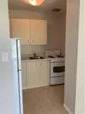 Cabinets and stove in kitchen area