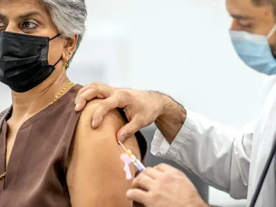 woman-gets-covid-vaccine.jpg