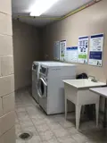 Washer, dryer and wash basin in laundry room