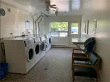 washing machines and chairs in laundry room