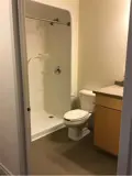 Shower, toilet and sink in bathroom