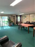 tables, chairs and armchairs in lounge area