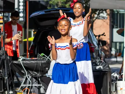 image of 2 young girls dancing at arts in the streets